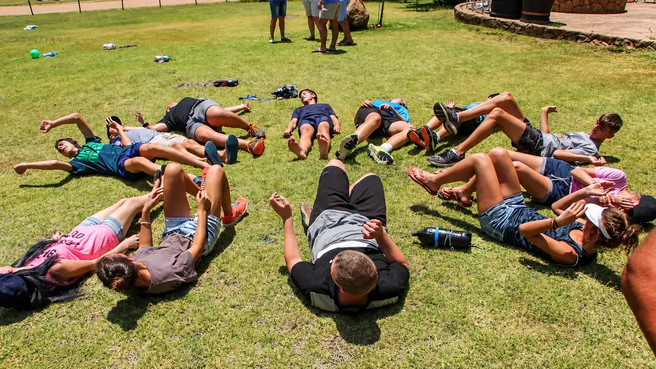 A group taking part in a shared outdoor challenge